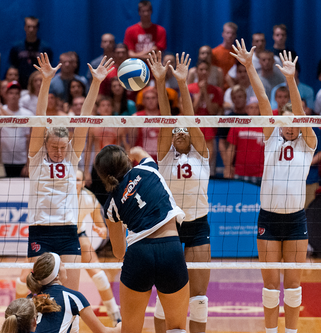 From left, University of Dayton players Shayne Brown, Isolde Hannan and Alaina Turner put up a triple block against an attack from Pepperdine University's Jazmine Orozco during an NCAA volleyball game, Aug. 25, 2012, at the Frericks Center, in Dayton, Ohio. UD won the match in four sets.