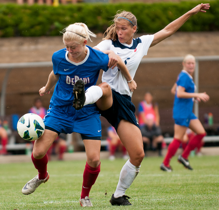 Junior defender Meghan Scharer, right, goes lunges for a ball during a game between the University of Dayton and DePaul University, Sept. 2, 2012, at the Baujan Field, in Dayton, Ohio. DePaul won 2-1 in overtime.