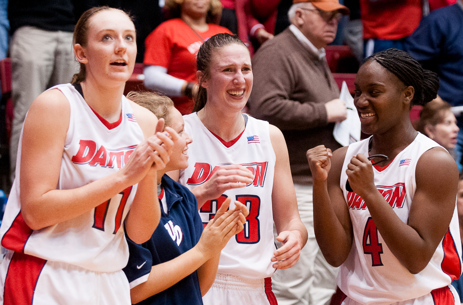 From left, the University of Dayton's Ally Malott, Abby Bush, Cassie Sant and Olivia Applewhite celebrate on the bench as the last seconds expire during a game against No. 13 Vanderbilt University at UD Arena, Nov. 18, 2012, in Dayton, Ohio. UD won 71-66.