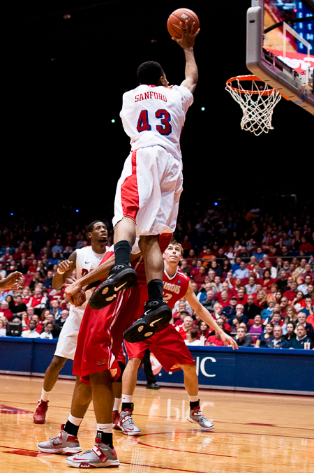 University of Dayton redshirt junior guard Vee Sanford (43) shoots over a Redbird defender in the closing minutes of a game against Illinois State University at UD Arena, Dec. 19, 2012, in Dayton, Ohio. Illinois State won 74-73.
