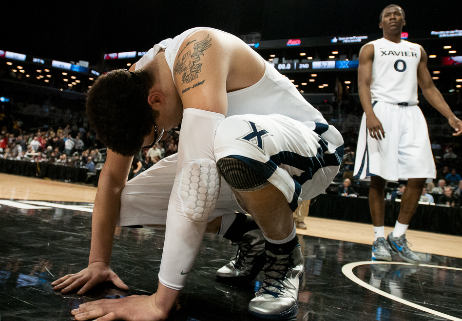 Xavier University junior Isaiah Philmore reacts to losing to Saint Joseph's in the Atlantic 10 tournament, 58-57, at Barclays Center, March 14, 2013, in Brooklyn.